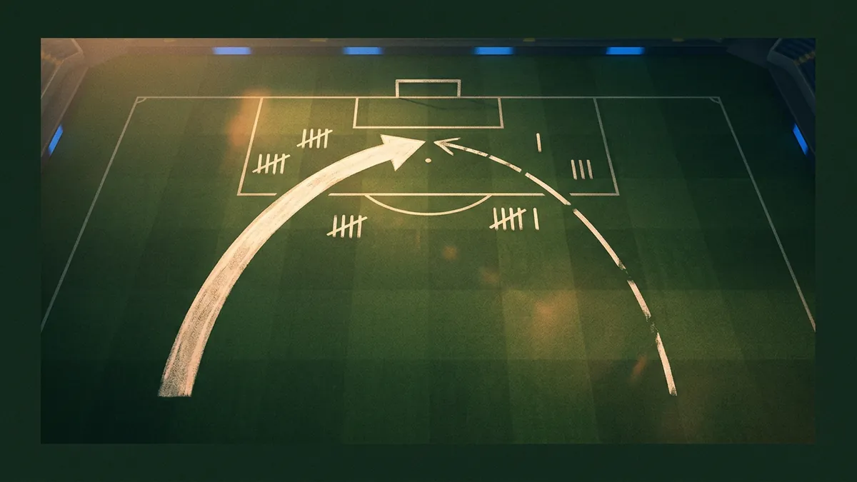 Aerial view of a green football pitch with chalk-drawn tactical arrows, a large curved arc, and tally marks scattered across the half, lit by warm floodlights against a dark stadium border.