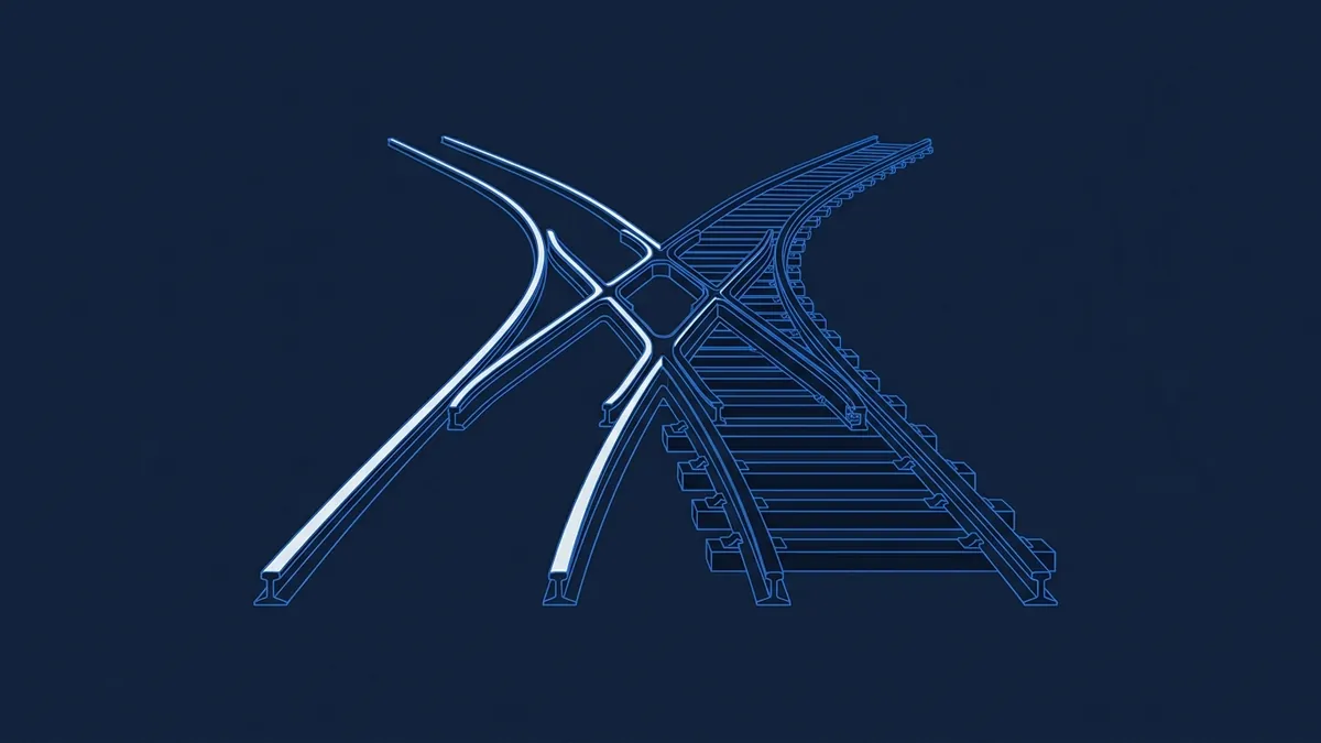 A blueprint-style technical drawing of railway track points and a junction, rendered in glowing blue lines on a dark navy background, showing rails diverging and crossing.